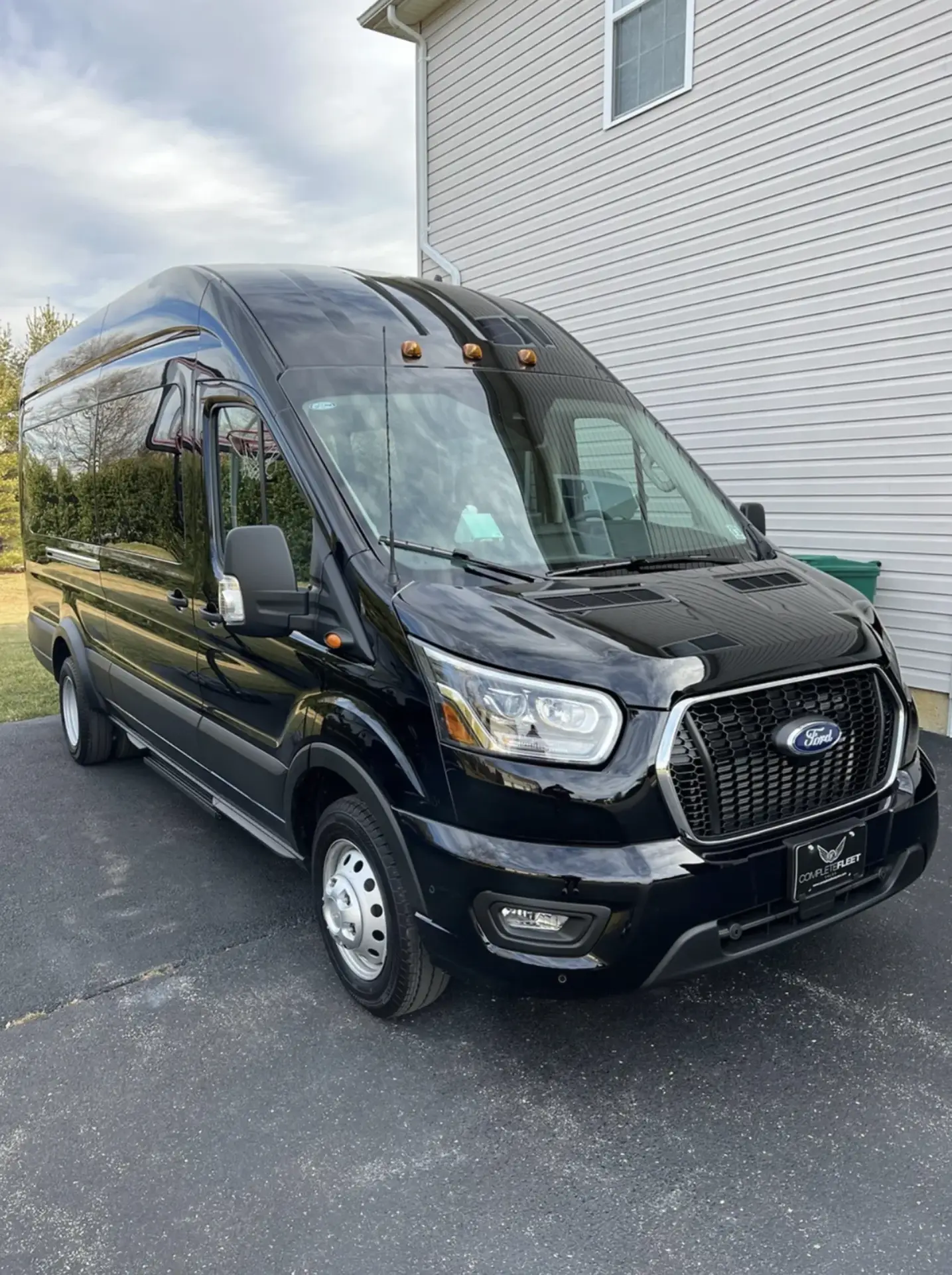 Black Ford Transit executive van โ Basking Ridge Limousine crew and group transportation at Trenton-Mercer Airport
