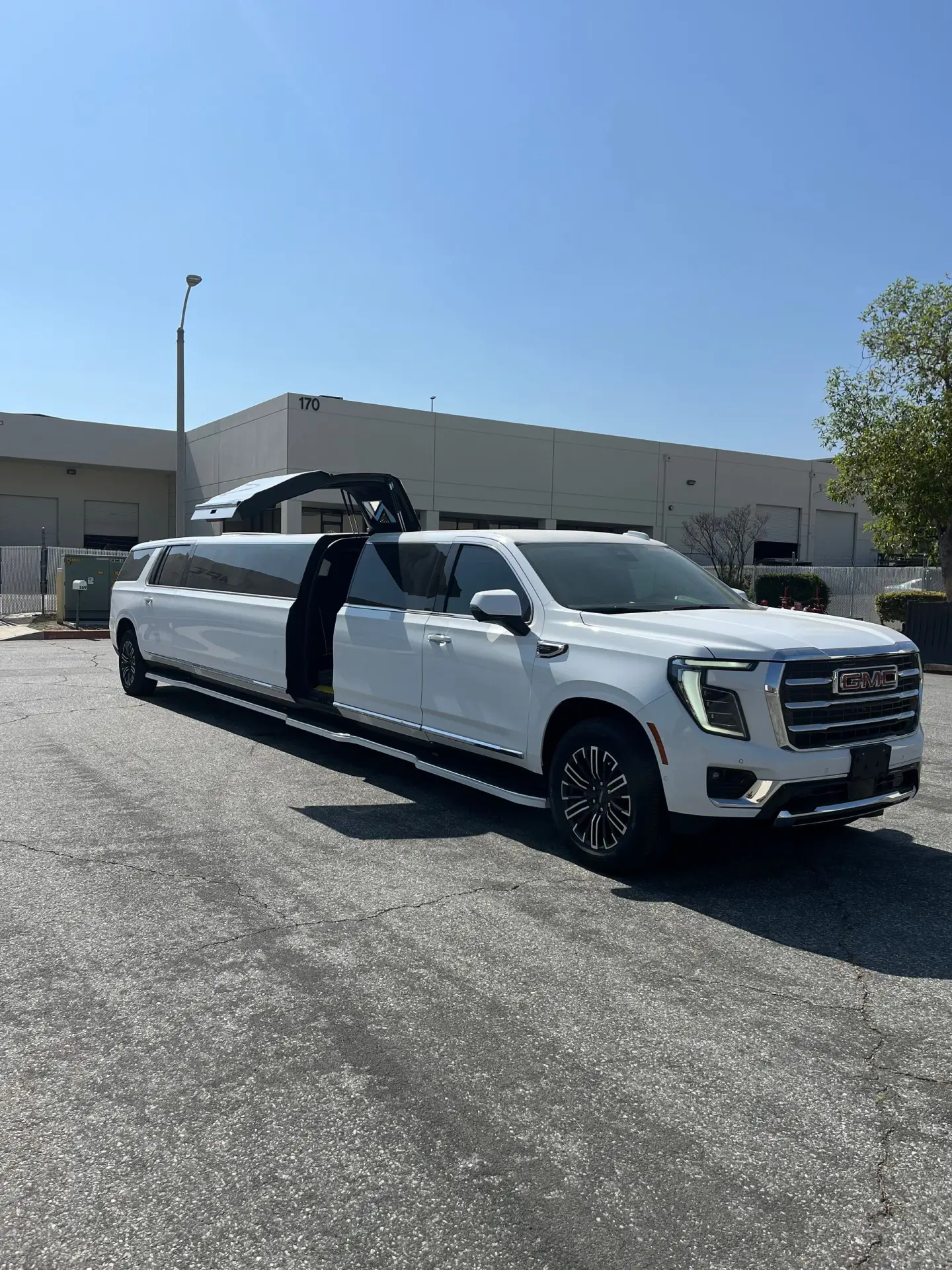 Basking Ridge Limousine’s 2025 GMC Yukon Stretch Limousine with gullwing door open.