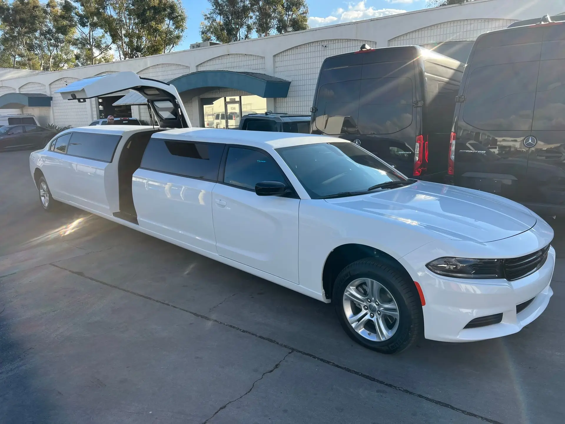 White Dodge Charger Stretch Limousine with gullwing door open – Basking Ridge Limousine Services