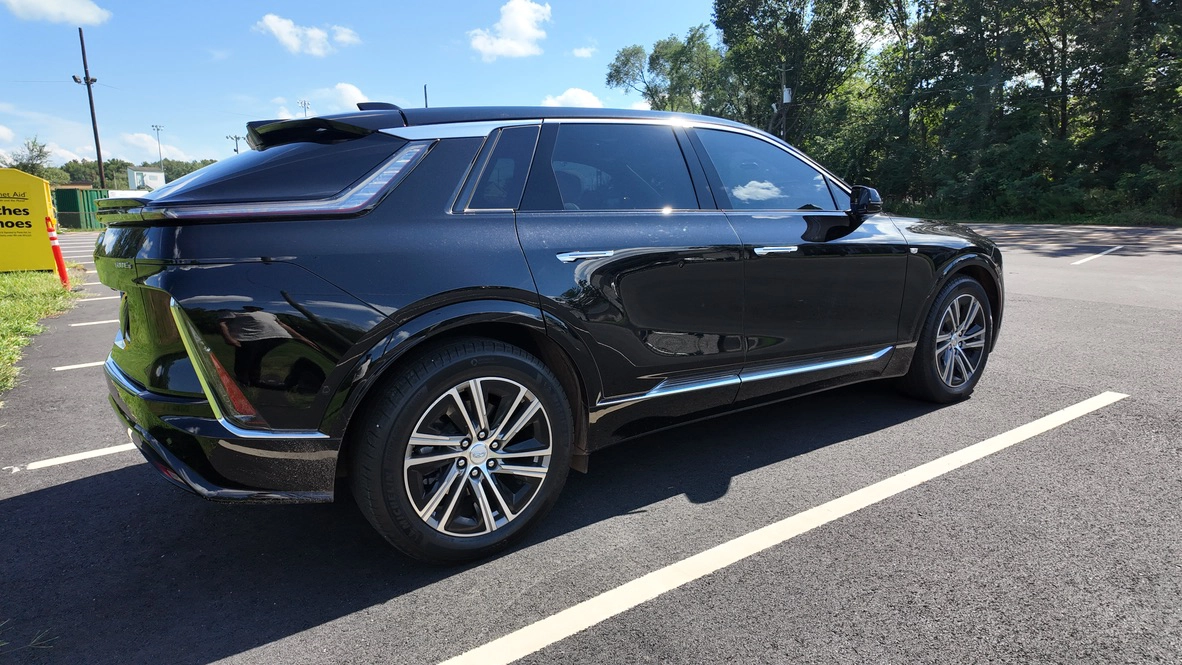 Rear three-quarter view of black 2025 Cadillac LYRIQ EV