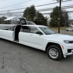 2024 Jeep Grand Cherokee stretch limousine white exterior with passenger door open