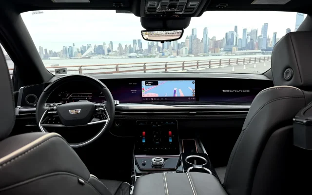 Inside view of 2025 Cadillac Escalade Platinum showcasing OLED display, leather cabin, and Manhattan skyline — Basking Ridge Limousine NJ
