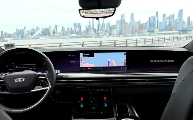 2025 Cadillac Escalade Platinum interior with 55-inch curved OLED display and Manhattan skyline through windshield — Basking Ridge Limousine NJ