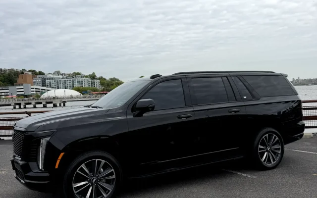 Side profile of 2025 Cadillac Escalade Platinum SUV in black — luxury chauffeur fleet vehicle by Basking Ridge Limousine Services New Jersey