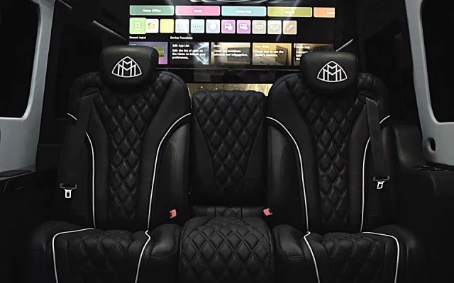 Luxury interior of 2026 Mercedes Maybach Jet Sprinter with captain chairs and entertainment screen