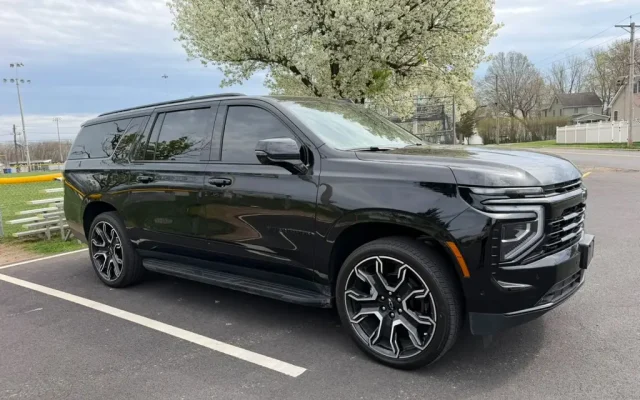 2026 Black Chevrolet Suburban luxury SUV three-quarter front view – NJ limo service