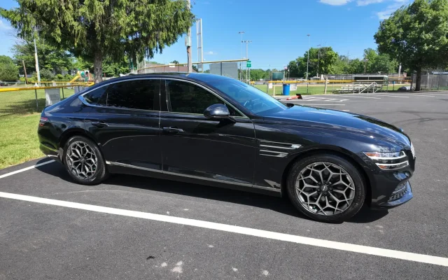 Genesis G80 black luxury sedan side profile – executive car service Basking Ridge NJ