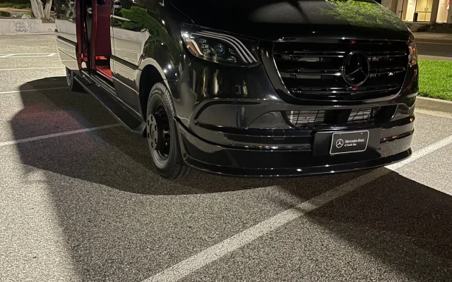 2025 Mercedes Sprinter Maybach limo party bus black exterior at night — 14-passenger luxury party bus serving Basking Ridge, Morristown, Morris County and Somerset County NJ