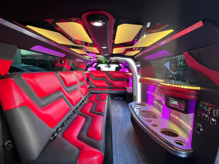 Red and black seating inside Chrysler 300 stretch limousine