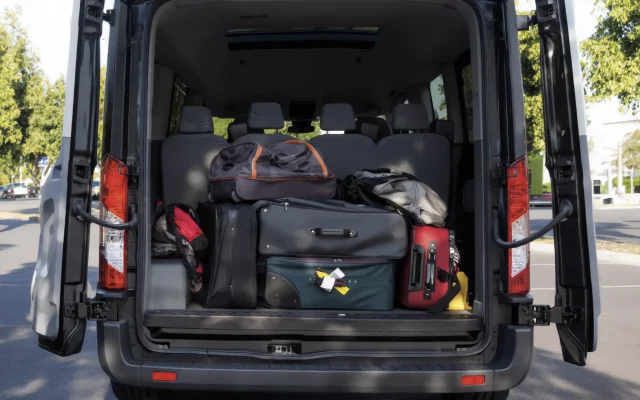Rear luggage area of an actual 14 passenger Ford Transit van with space behind the seats